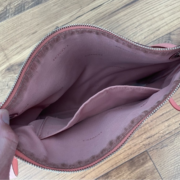 Gently used blush pink leather Coach crossbody bag with silver chain. - Picture 4 of 5